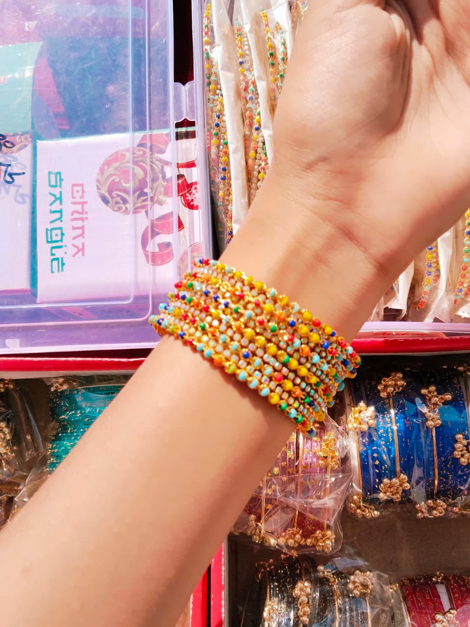 Discover the vibrant charm of traditional Indian bangles in a stunning array of colors.