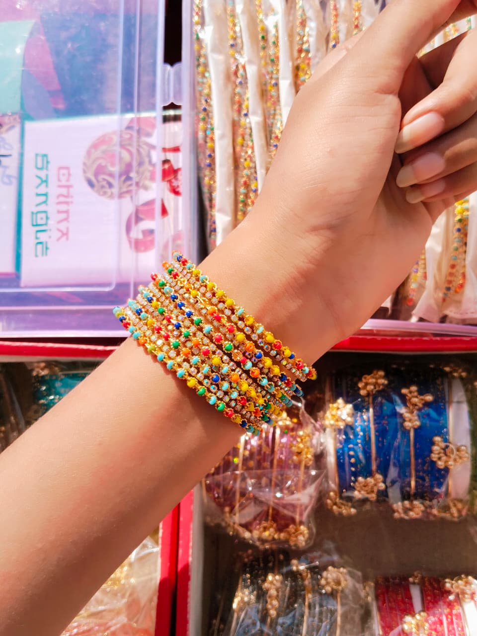 Discover the vibrant charm of traditional Indian bangles in a stunning array of colors.